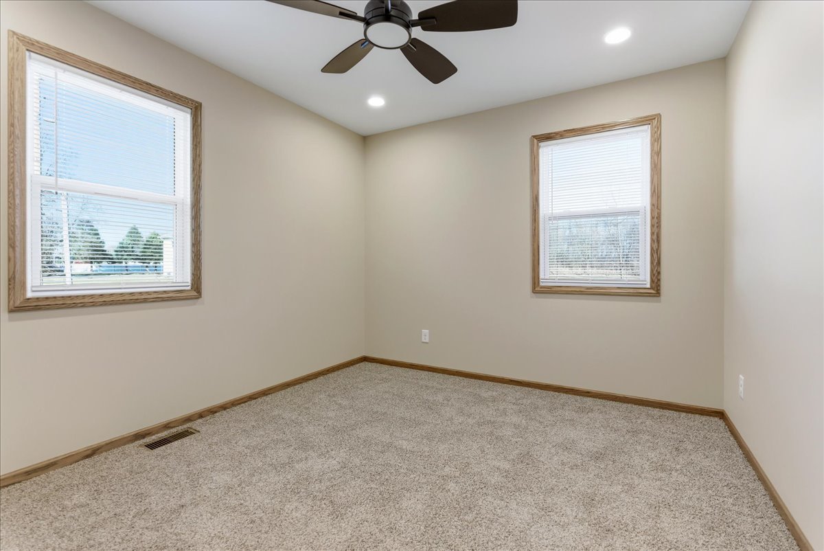 313 East Martin Street Forrest, IL 61741 - Photo 36 of 50 an empty room with a window and a ceiling fan