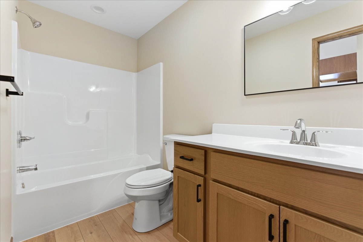 313 East Martin Street Forrest, IL 61741 - Photo 39 of 50 a bathroom with a sink a toilet and shower