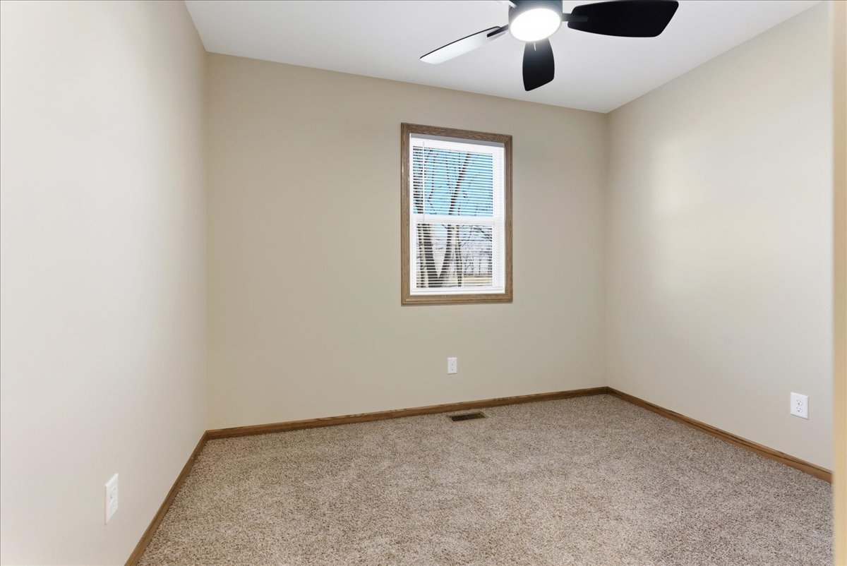 313 East Martin Street Forrest, IL 61741 - Photo 42 of 50 an empty room with a window
