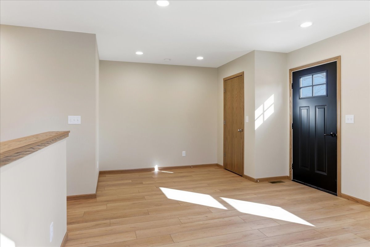 313 East Martin Street Forrest, IL 61741 - Photo 5 of 50 a view of an empty room with wooden floor