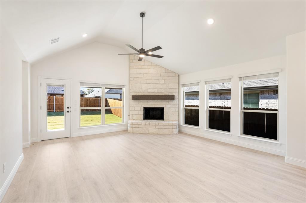 2009 Ambergate Drive Anna, TX 75409 - Photo 14 of 36 a view of an empty room with a fireplace and a window