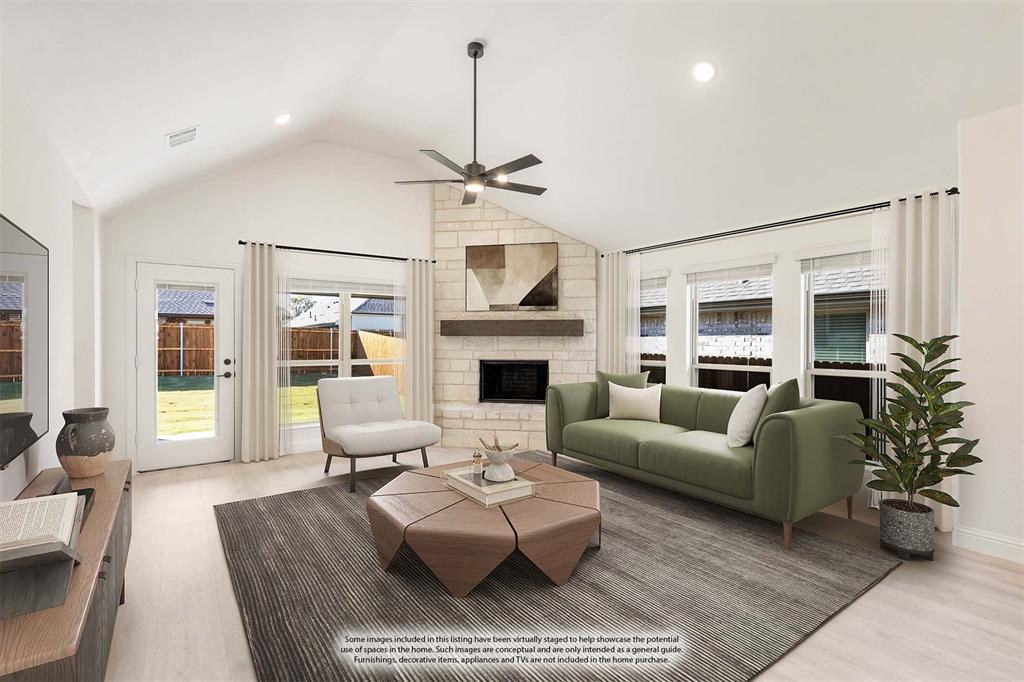 2009 Ambergate Drive Anna, TX 75409 - Photo 15 of 36 a living room with furniture a fireplace and a flat screen tv