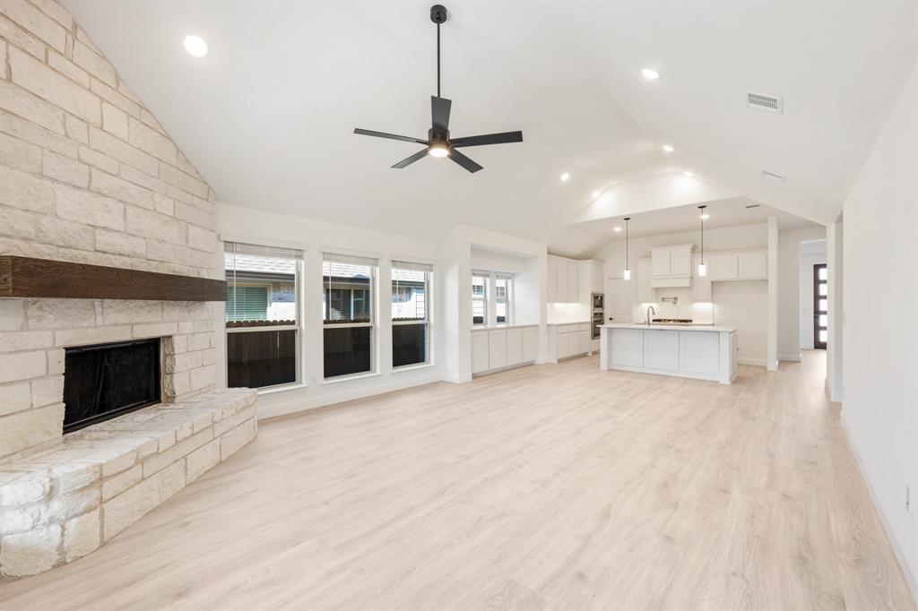 2009 Ambergate Drive Anna, TX 75409 - Photo 16 of 36 a view of a kitchen with a sink and a fireplace