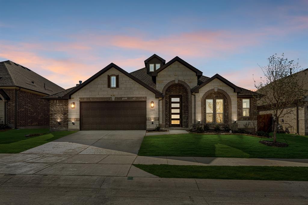 2009 Ambergate Drive Anna, TX 75409 - Photo 2 of 36 a front view of a house with a yard and garage