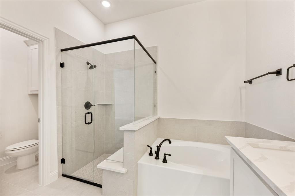 2009 Ambergate Drive Anna, TX 75409 - Photo 22 of 36 a bathroom with a sink a toilet and shower