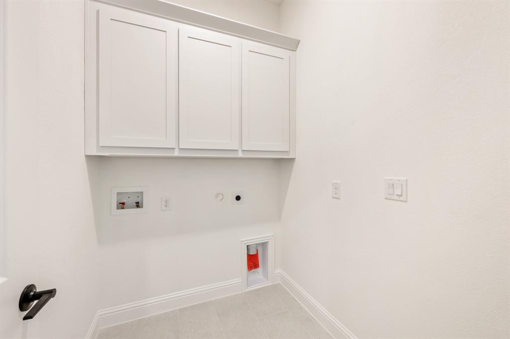 2009 Ambergate Drive Anna, TX 75409 - Photo 32 of 36 a utility room with dryer and washer