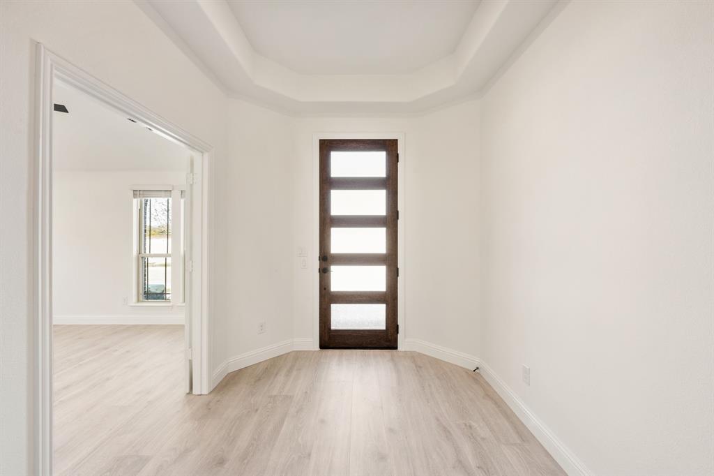 2009 Ambergate Drive Anna, TX 75409 - Photo 5 of 36 an empty room with windows and closet