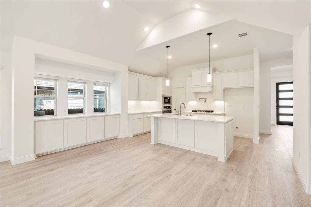 2009 Ambergate Drive Anna, TX 75409 - Photo 10 of 36 a kitchen with white cabinets and window