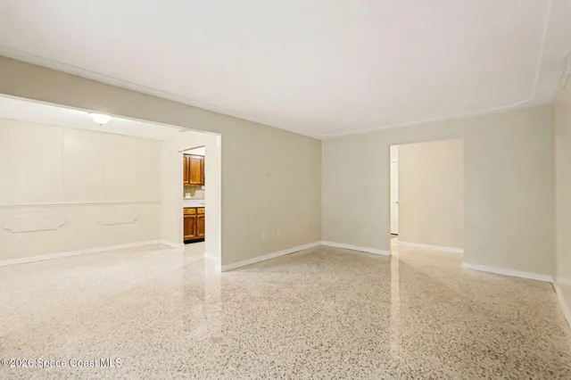 an empty room with a empty space and parking space