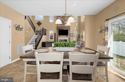a kitchen with granite countertop a sink and cabinets