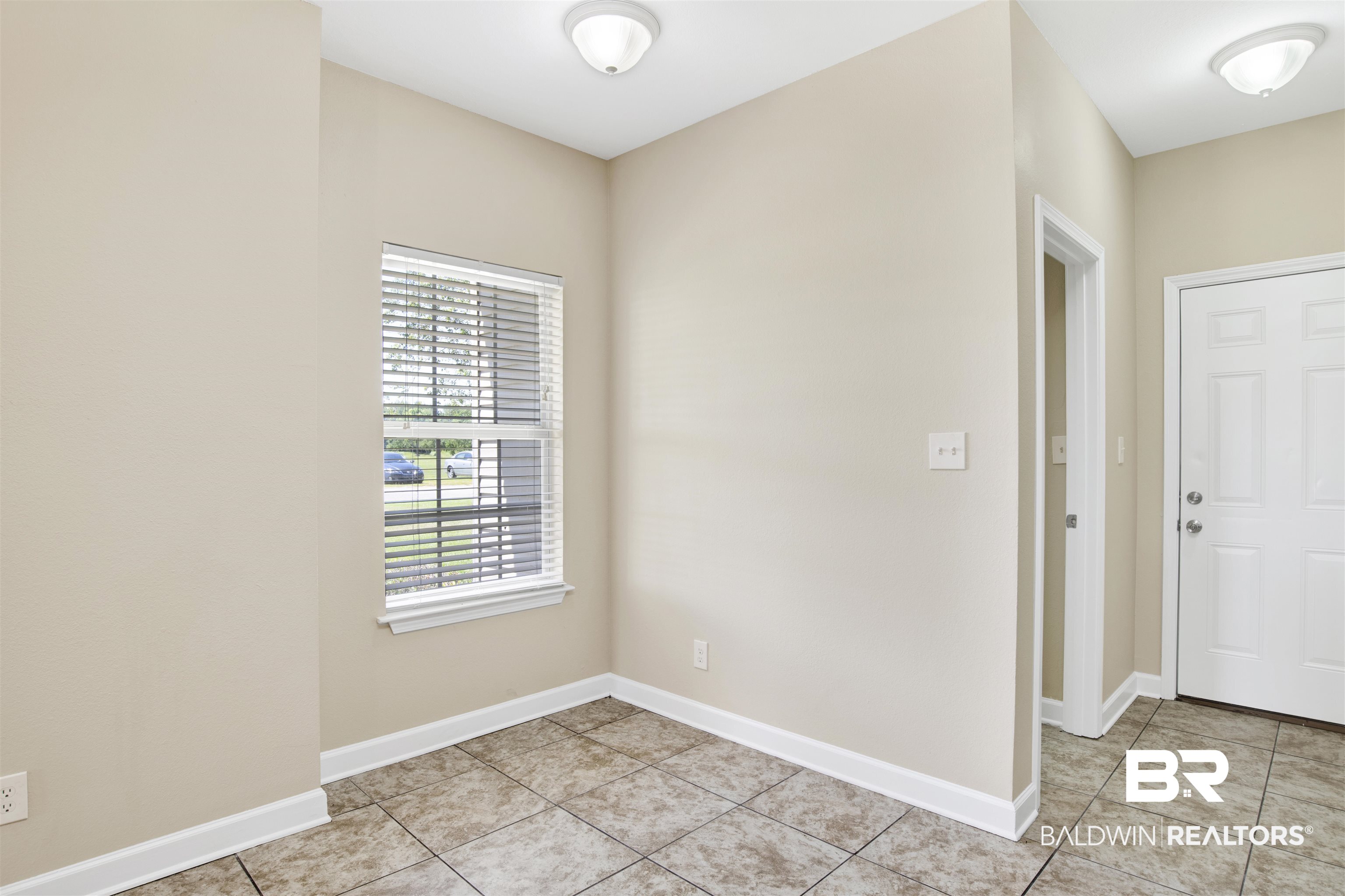2002 Shelene Way Foley, AL 36535 - Photo 11 of 23 Foyer entrance with baseboards and light tile patterned floors