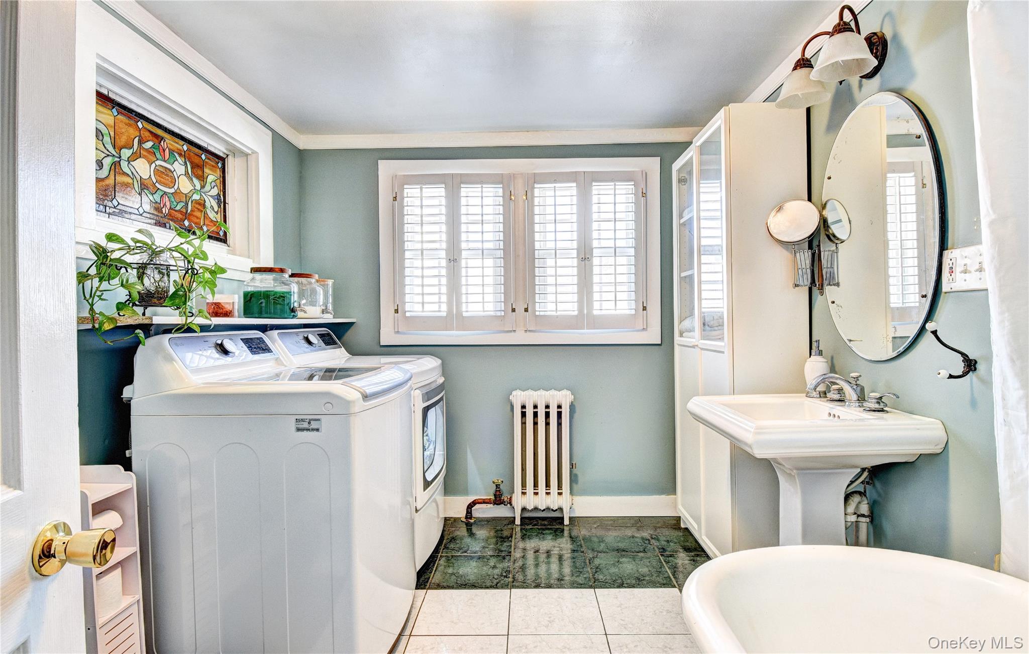 99 South Main Street Florida, NY 10921 - Photo 18 of 43 a bathroom with a sink and mirror with toilet