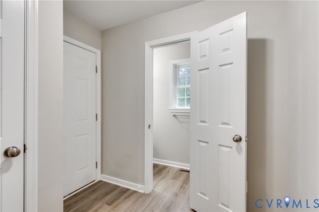 6320 Walnut Tree Drive Powhatan, VA 23139 - Photo 12 of 34 Hall with light wood-style floors and baseboards