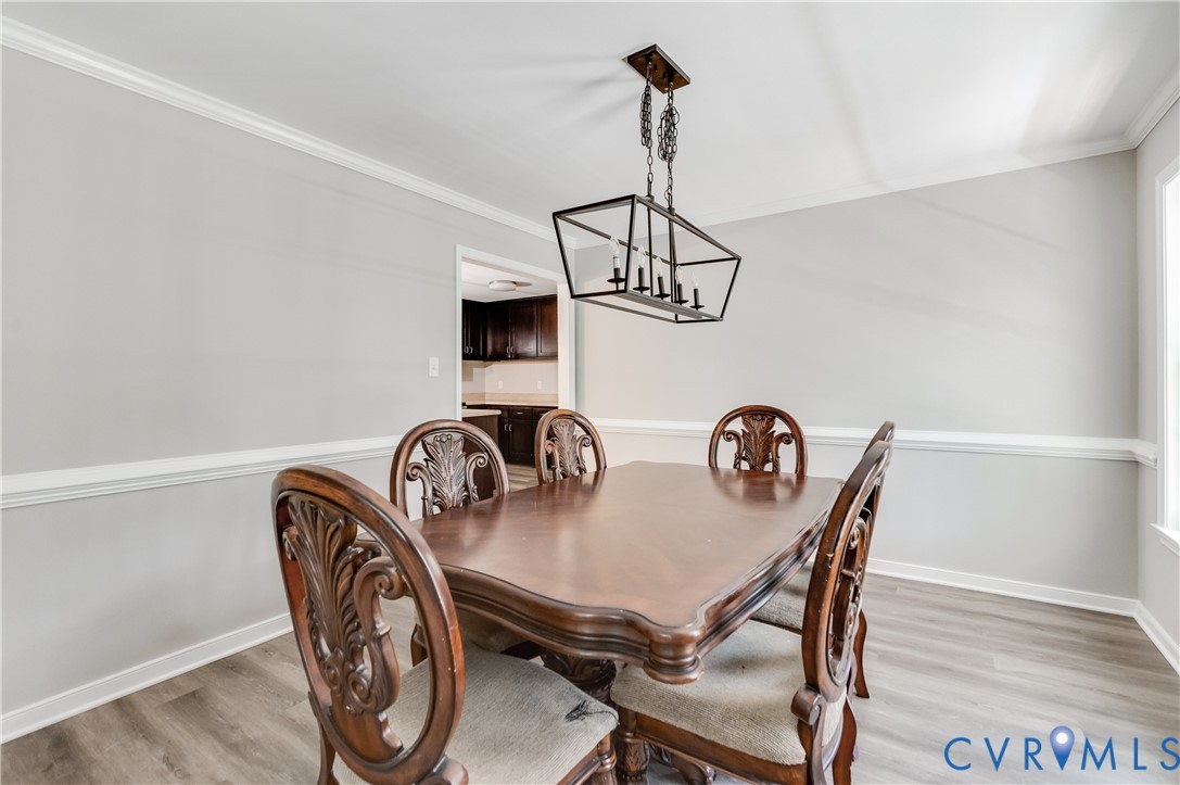 6320 Walnut Tree Drive Powhatan, VA 23139 - Photo 15 of 34 Dining space with light wood-style floors, ornamen