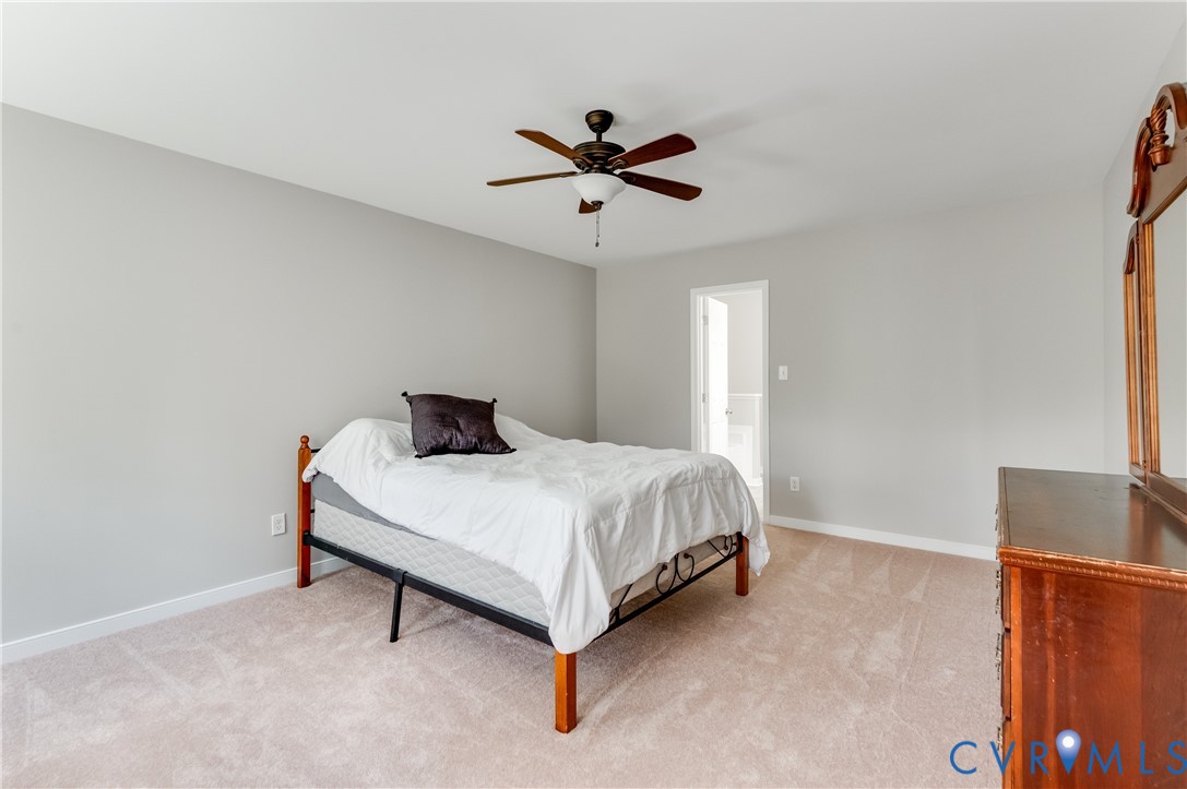 6320 Walnut Tree Drive Powhatan, VA 23139 - Photo 16 of 34 Bedroom featuring light colored carpet and a ceili