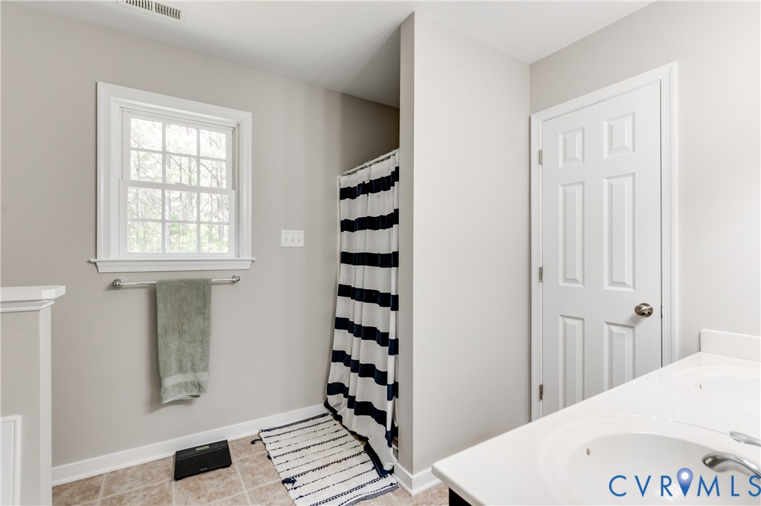 6320 Walnut Tree Drive Powhatan, VA 23139 - Photo 18 of 34 Full bathroom featuring double vanity, curtained s