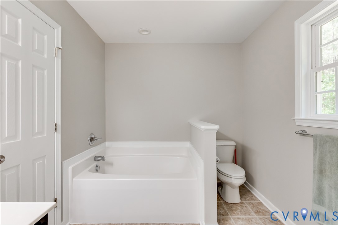 6320 Walnut Tree Drive Powhatan, VA 23139 - Photo 20 of 34 Bathroom featuring a garden tub and light tile pat