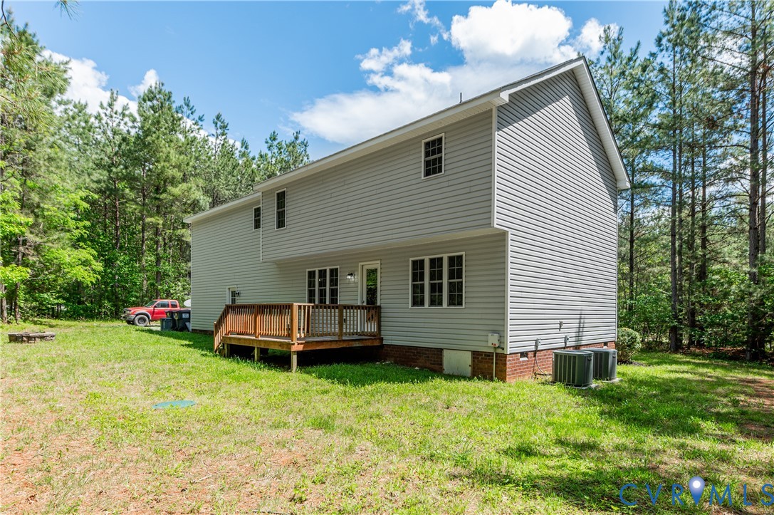 6320 Walnut Tree Drive Powhatan, VA 23139 - Photo 30 of 34 Back of house featuring a wooden deck, a lawn, cra