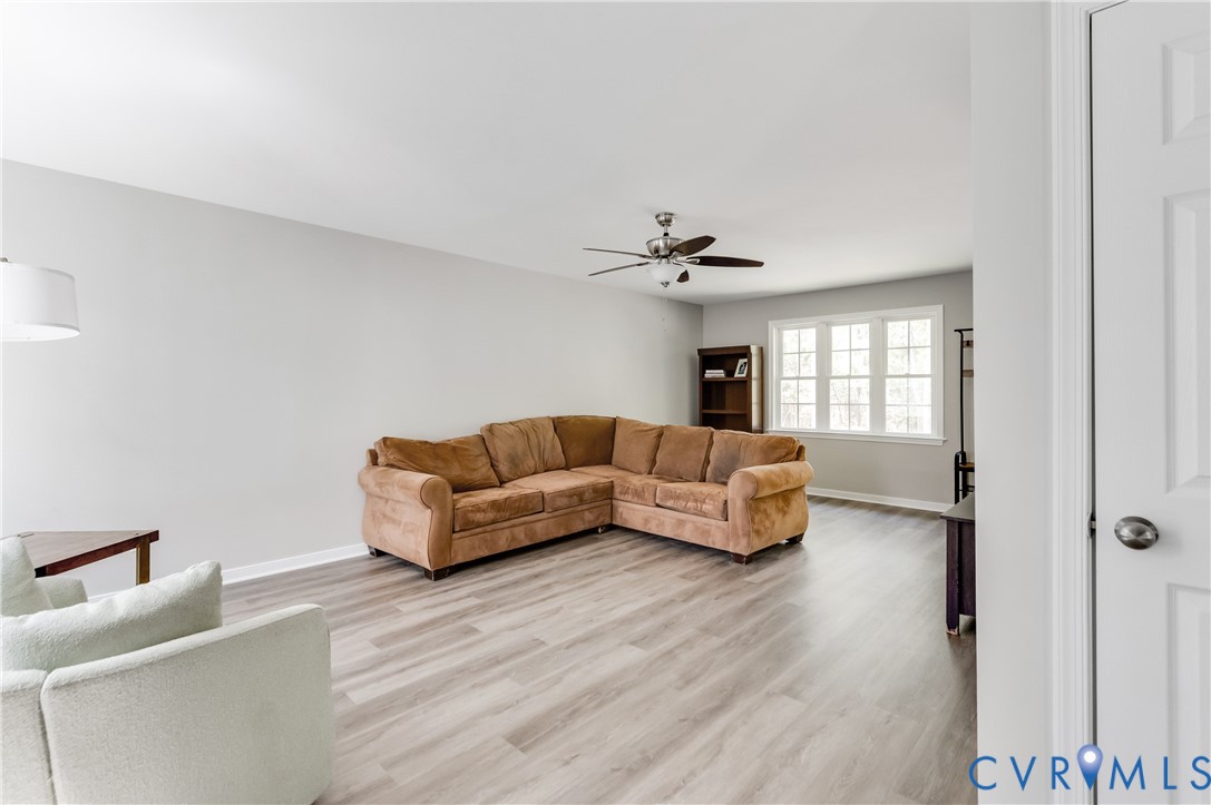 6320 Walnut Tree Drive Powhatan, VA 23139 - Photo 3 of 34 Living area with light wood-style flooring and a c