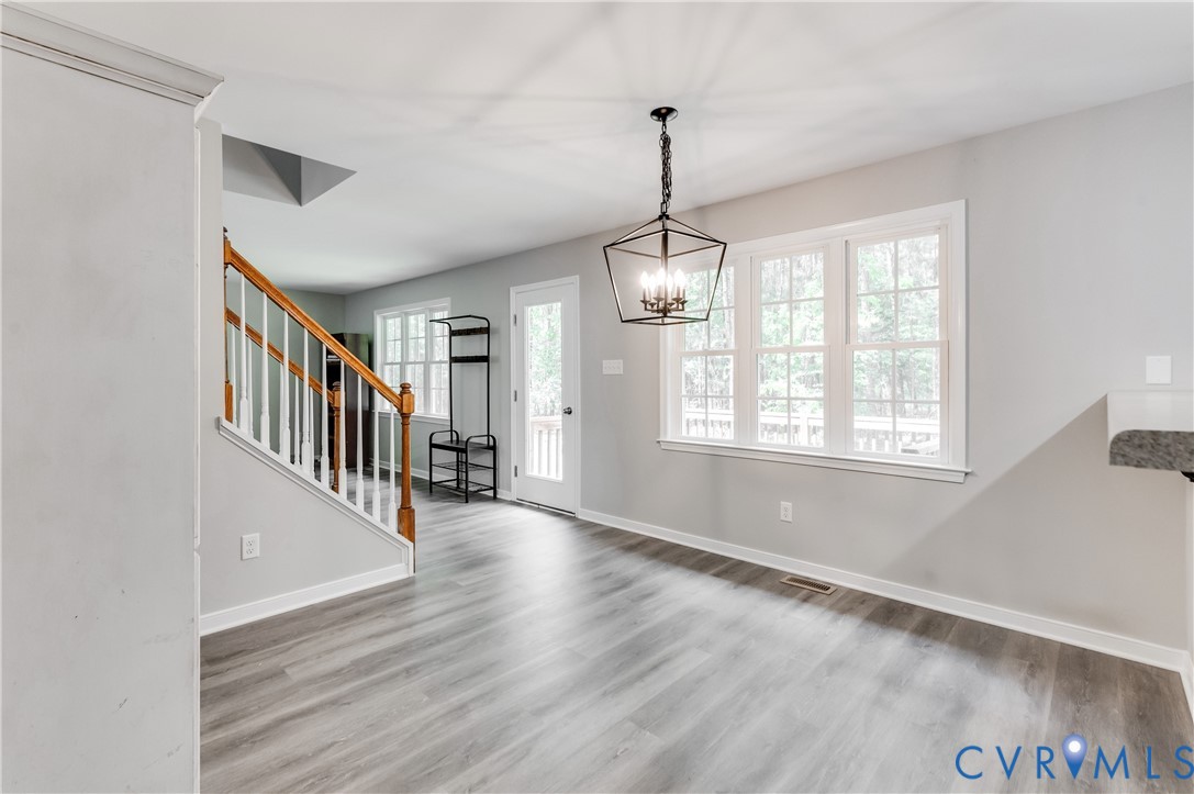6320 Walnut Tree Drive Powhatan, VA 23139 - Photo 7 of 34 Foyer entrance featuring stairway, wood finished f