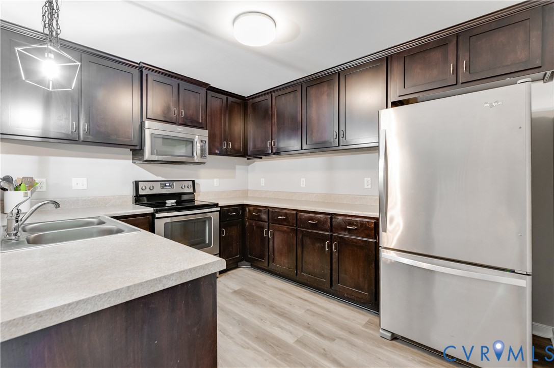 6320 Walnut Tree Drive Powhatan, VA 23139 - Photo 8 of 34 Kitchen featuring stainless steel appliances, dark