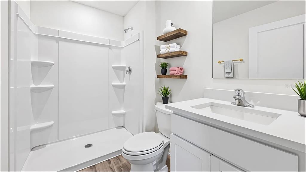 6855 Southwest 42nd Ct Road Ocala, FL 34476 - Photo 9 of 18 a bathroom with a sink toilet and shower