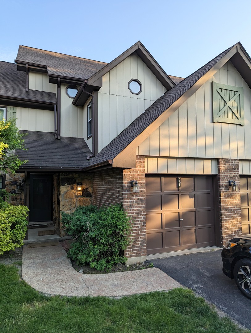 a front view of a house with garage