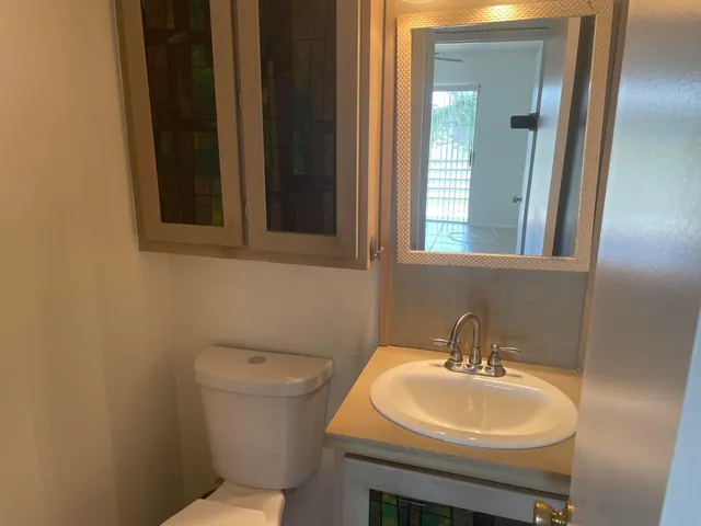 a bathroom with a sink and a toilet