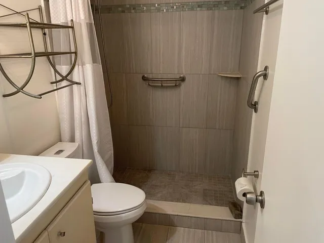 a bathroom with a sink and toilet