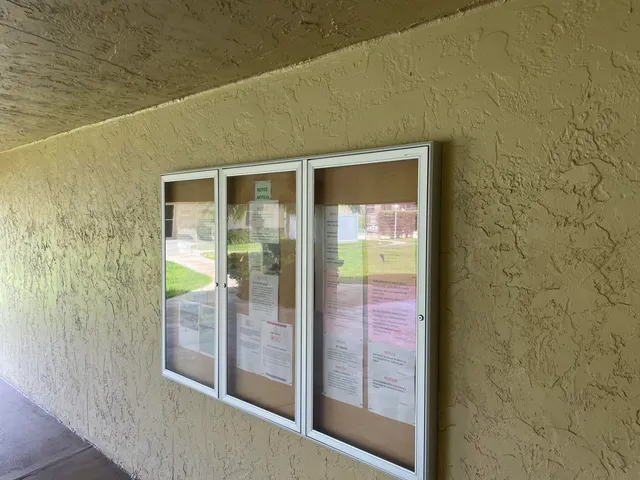 a bathroom with a glass door shower and a sink