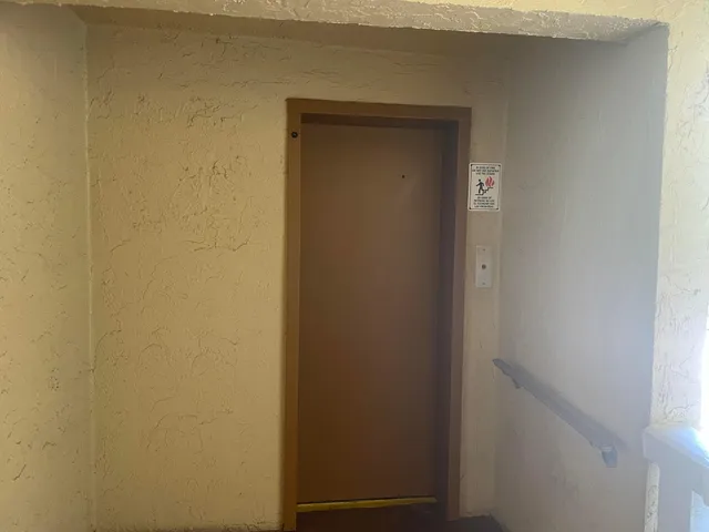 a view of a room with a wooden floor