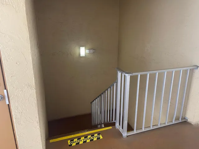 a kitchen with a refrigerator and a sink