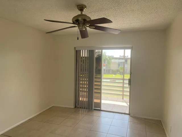 a view of an empty room and a window