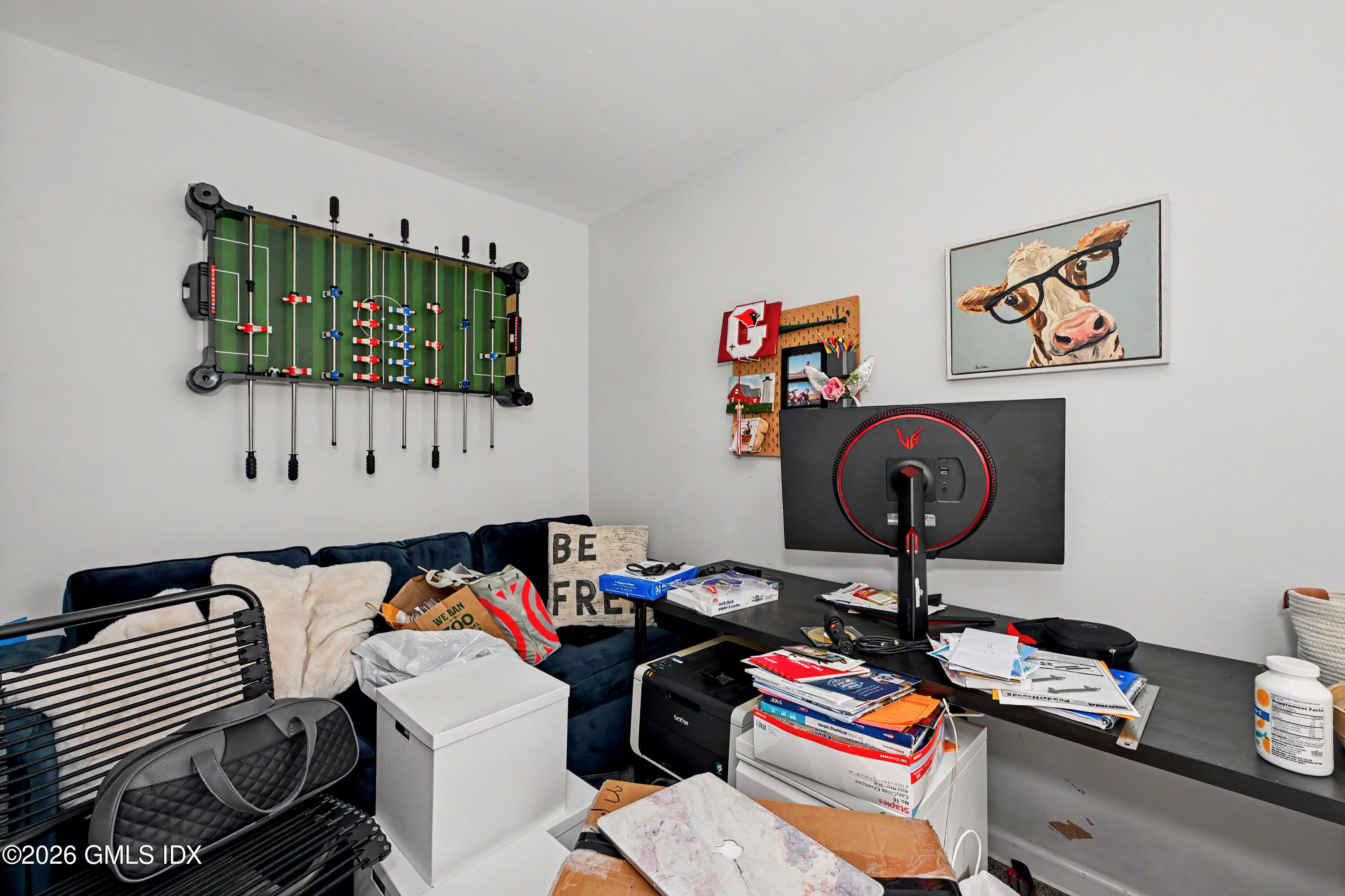 37 Prospect Street Greenwich, CT 06830 - Photo 13 of 41 a room with a workspace and a couch