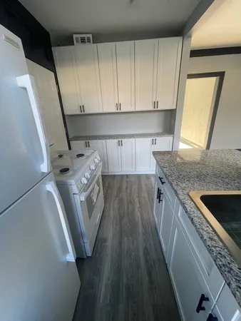 a kitchen with a sink a washer and dryer