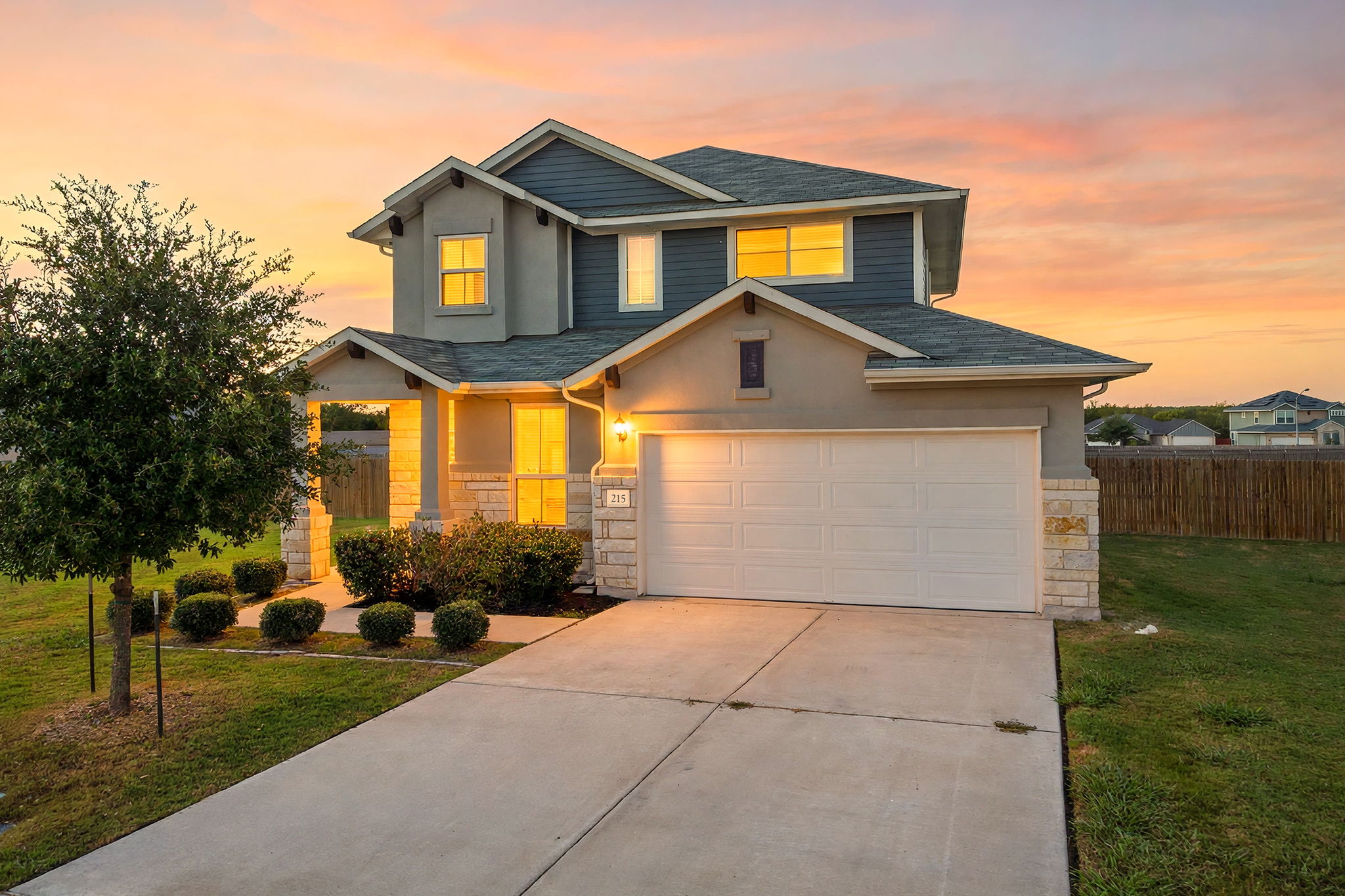 215 Lake Placid Run Elgin, TX 78621 - Photo 1 of 29 This modern two-story home with a stone and siding facade sits on over 1/3 acre.