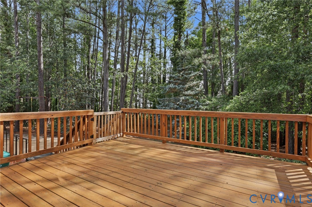 4701 Regal Oaks Road Glen Allen, VA 23059 - Photo 49 of 60 a balcony with wooden floor and trees
