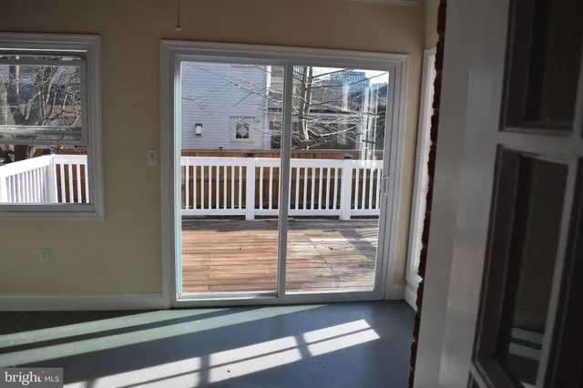 a view of empty room with windows