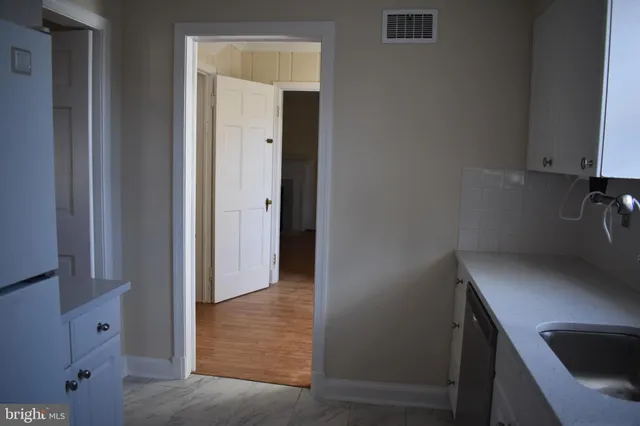 a view of a bathroom from the hallway