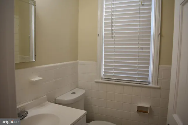 a bathroom with a toilet and a sink