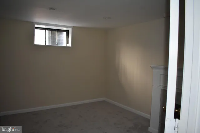 a bathroom with a sink and mirror with toilet