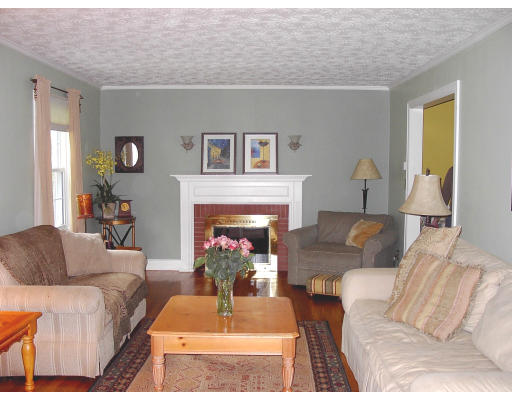103 Field Road Longmeadow, MA 01106 - Photo 2 of 7 a living room with furniture and a fireplace