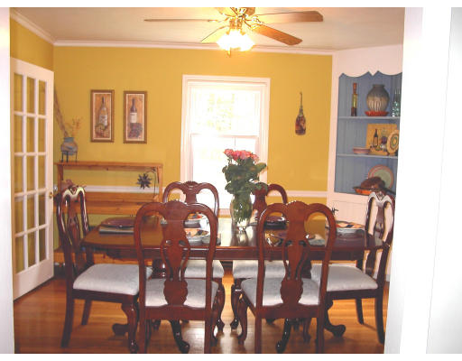 103 Field Road Longmeadow, MA 01106 - Photo 3 of 7 a view of a dining room with furniture and wooden floor