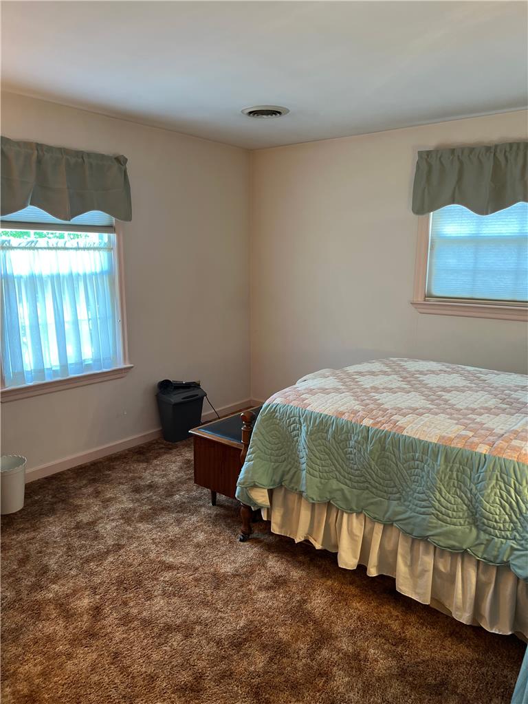 6830 Gun Club Road Coopersburg, PA 18036 - Photo 6 of 30 A cozy bedroom with plush carpeting and natural light streaming through dual windows.