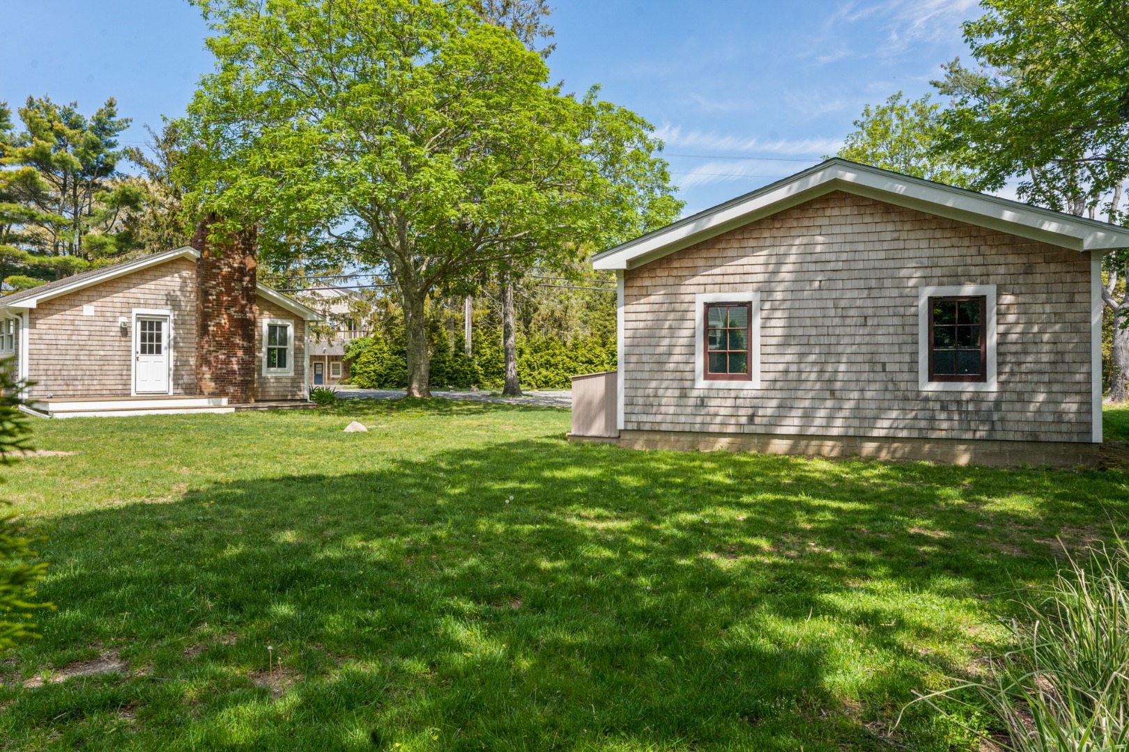 130 Wing Road Oak Bluffs, MA 02557 - Photo 20 of 21 Rear of garage at right and home at left.