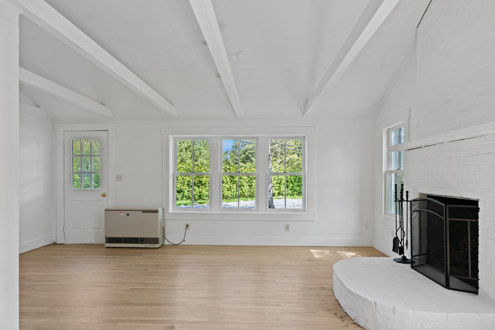130 Wing Road Oak Bluffs, MA 02557 - Photo 2 of 21 Living room to left and dining area in center.