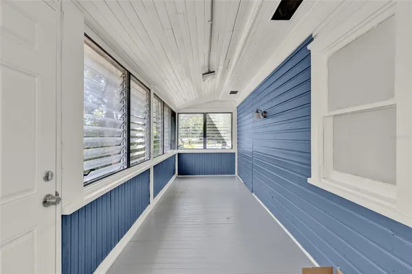 a view of a hallway with windows