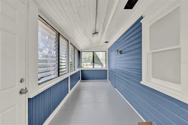 a view of a hallway with windows