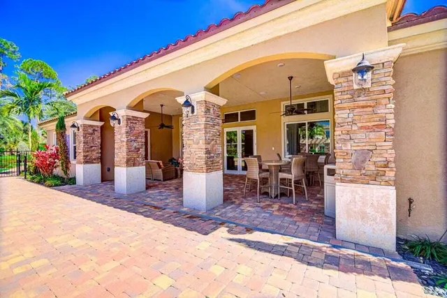 a view of a dining area with furniture and a kitchen view