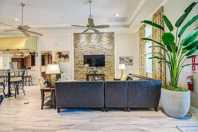 a bathroom with a granite countertop sink mirror and shower